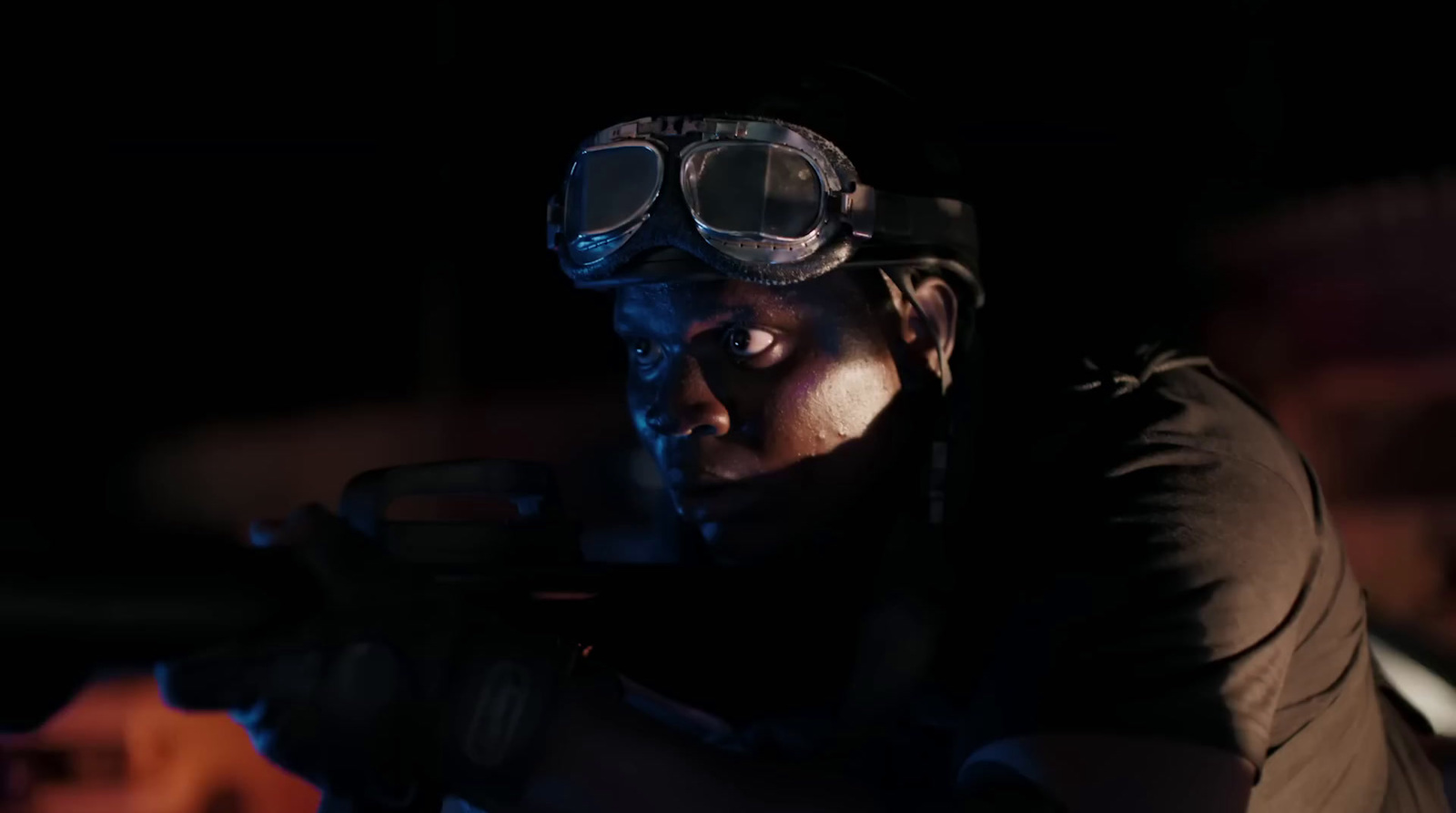 a man wearing goggles and holding a gun