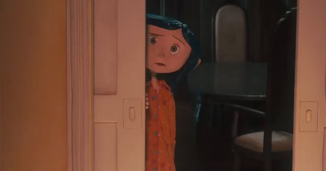 a doll is peeking out from behind a door