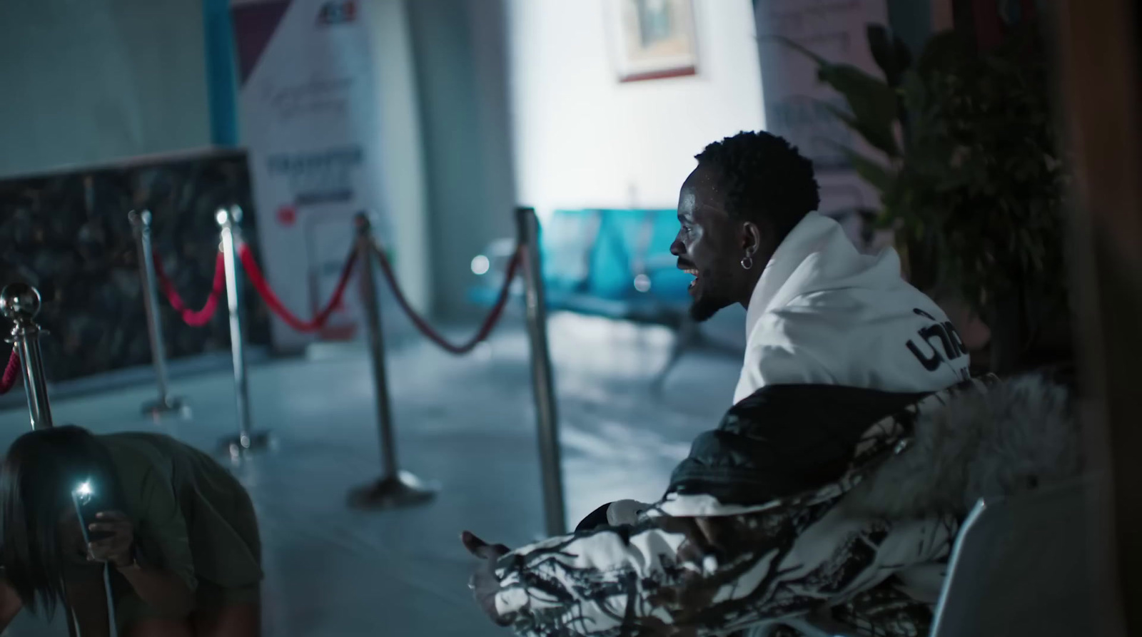 a man sitting in a chair in a room