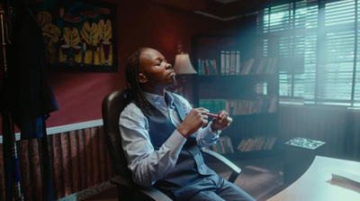 a man sitting at a desk in a room