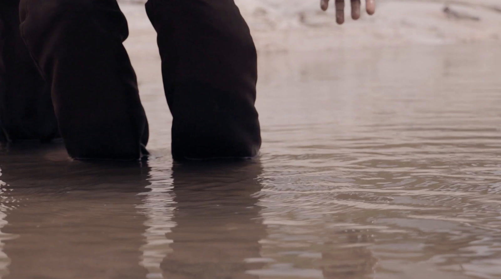 a person standing in a body of water