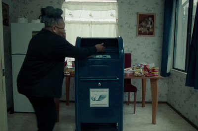 a woman standing next to a machine in a room