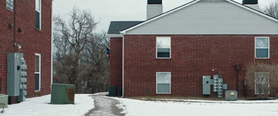 a brick building with a clock on the front of it