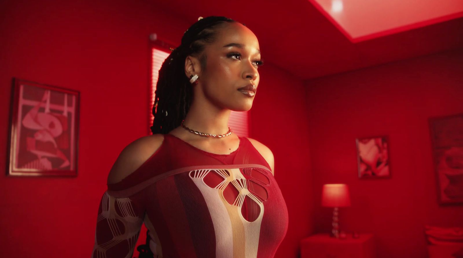 a woman in a red room with red walls