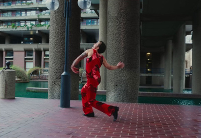 a man in a red suit is running