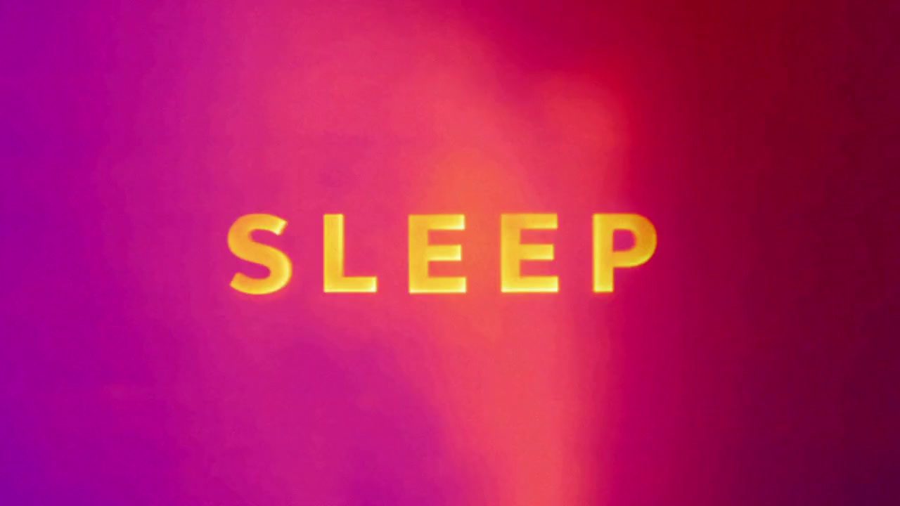 a blurry image of the word sleep on a wall