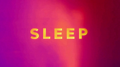 a blurry image of the word sleep on a wall