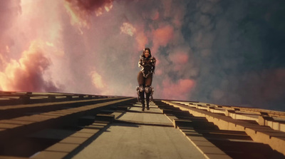 a man riding a bike down a cement road