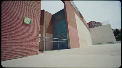 a red brick building with a metal hand rail