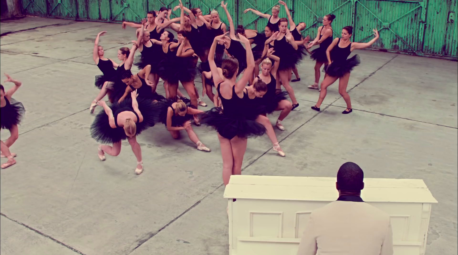 a group of dancers performing on a stage