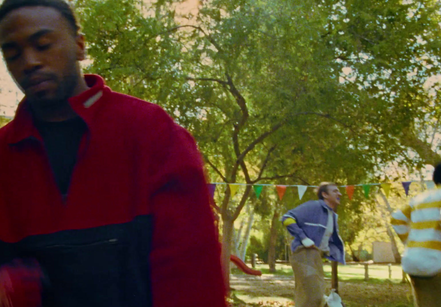 a group of men standing next to each other in a park