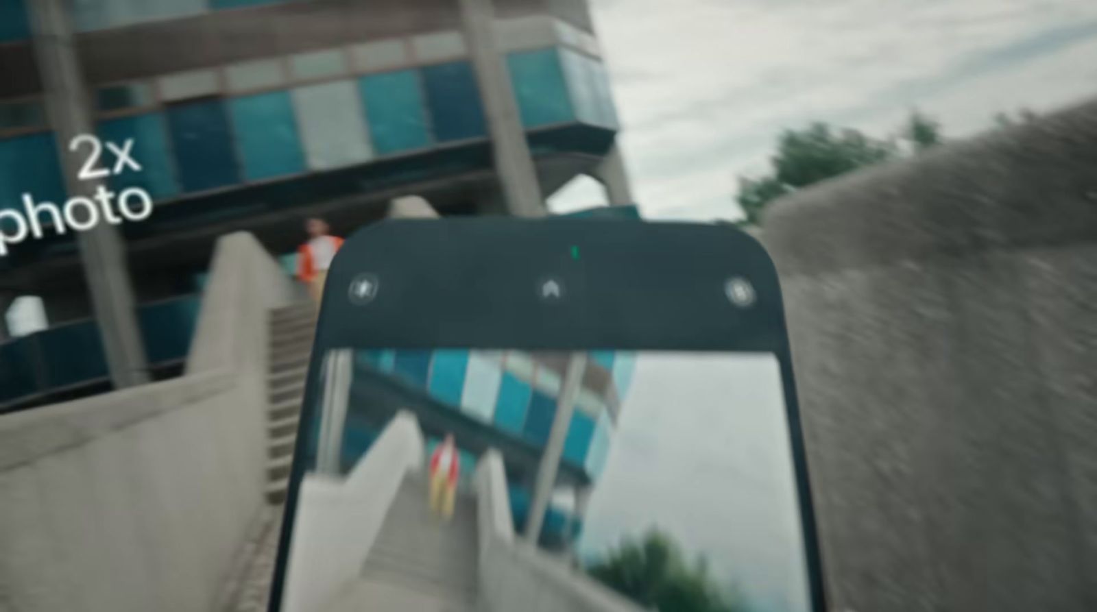 a close up of a cell phone with a building in the background