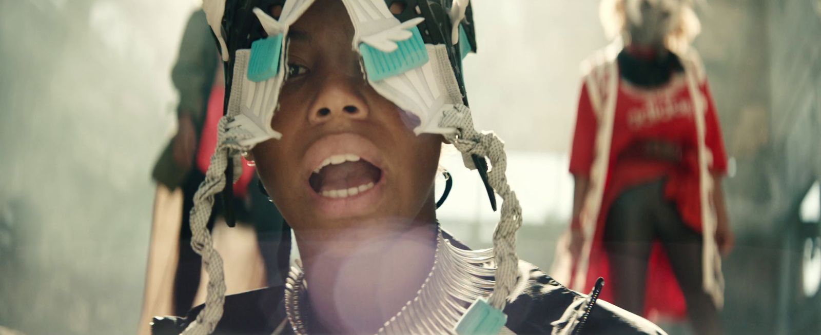 a woman with her mouth open standing in front of a mirror