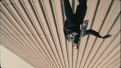 a man flying through the air while riding a snowboard