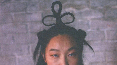 a woman with a strange hair piece on her head