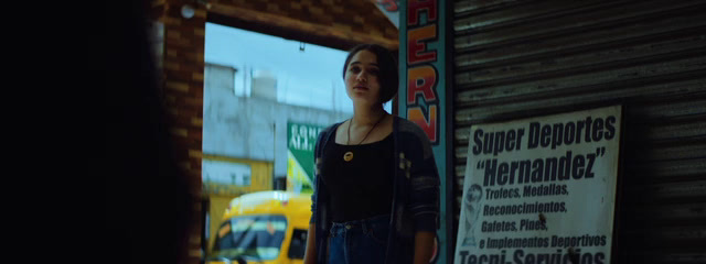 a woman standing in front of a store