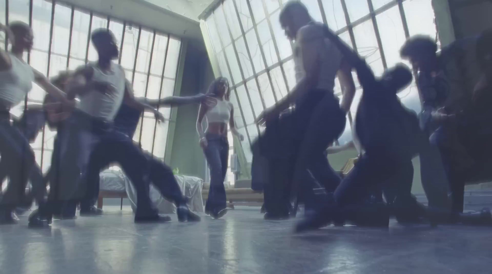 a group of people dancing in a large room