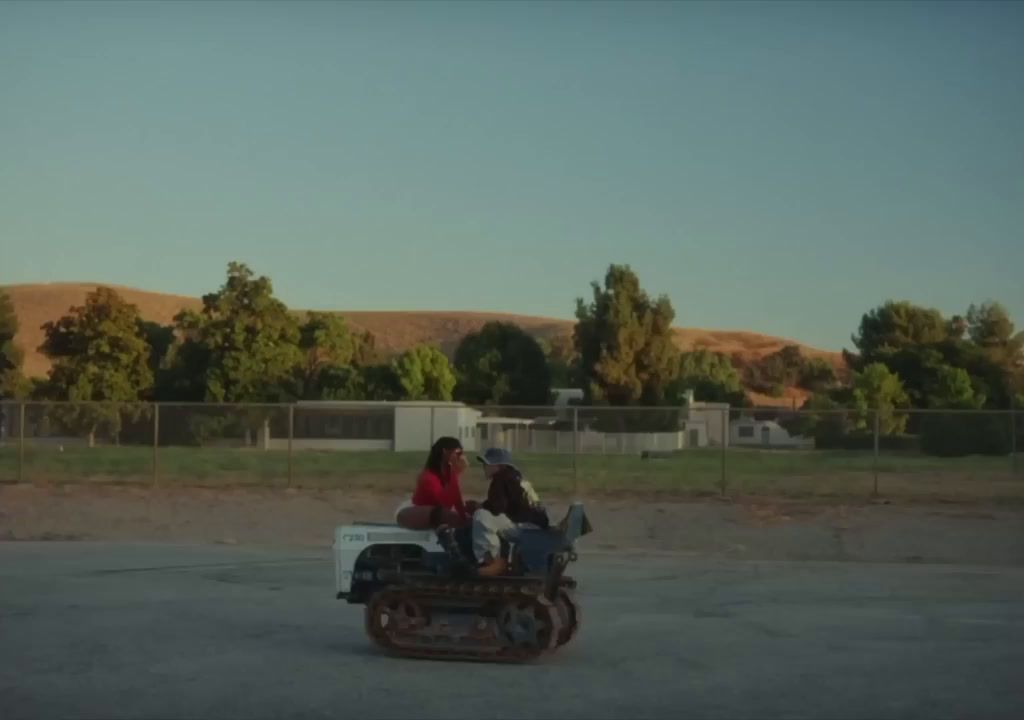 a group of people riding on the back of a motorcycle