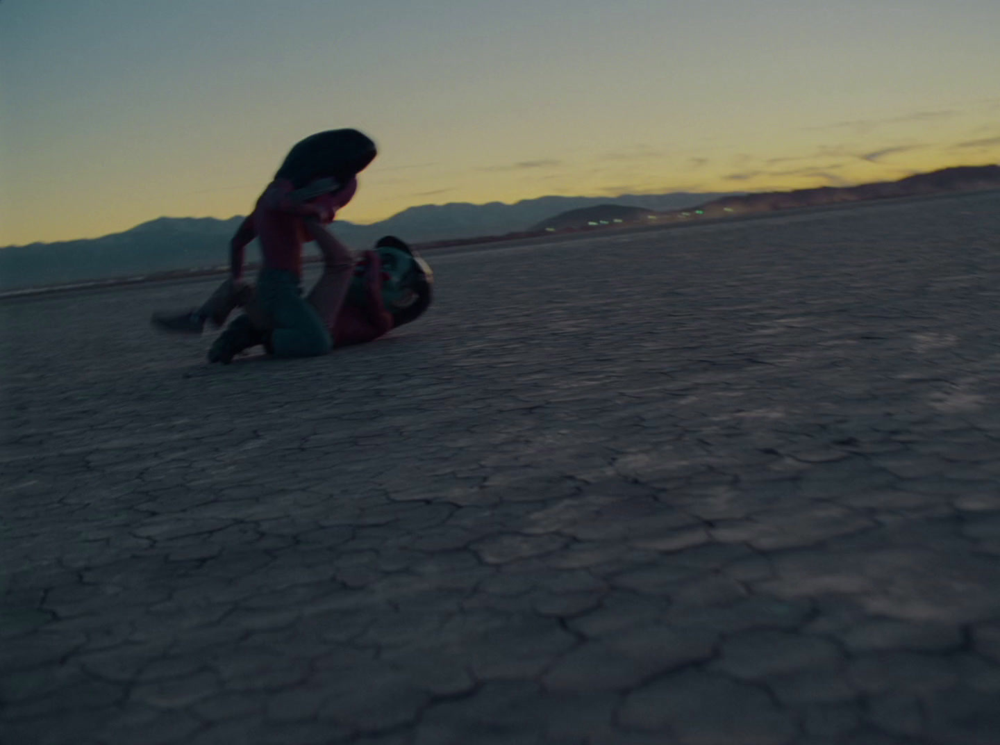 a couple of people that are sitting on the ground