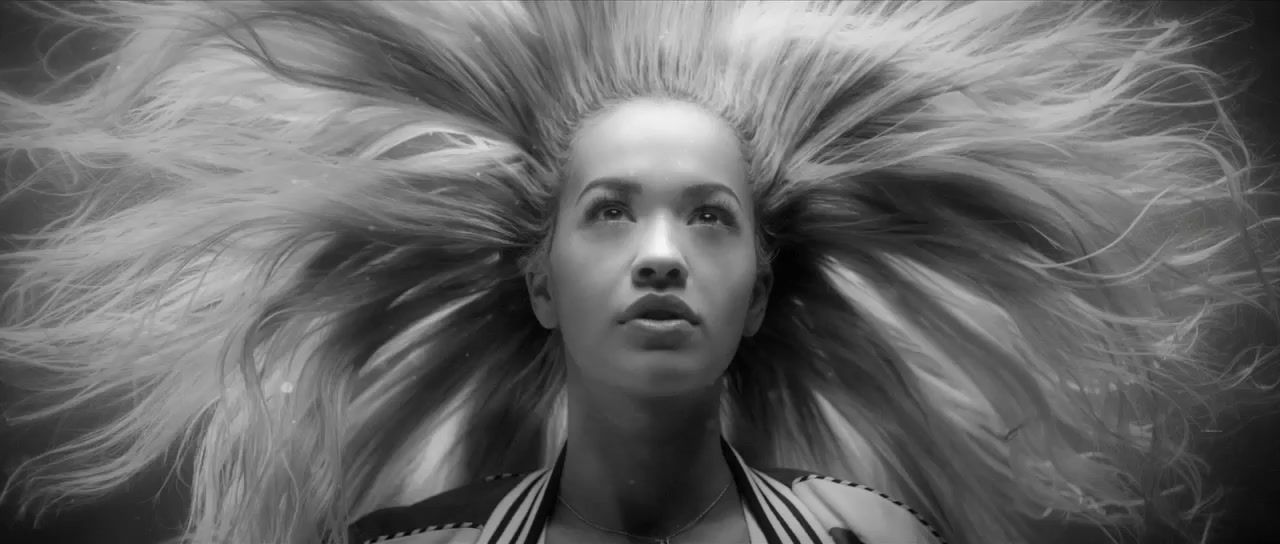 a woman with long blonde hair in a black and white photo