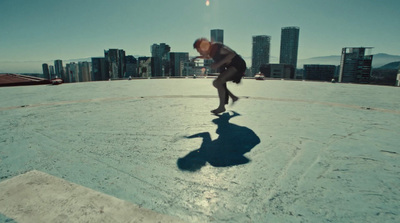 a man riding a skateboard on top of a roof