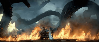 a scene from a sci - fi movie with a giant fire breathing dragon