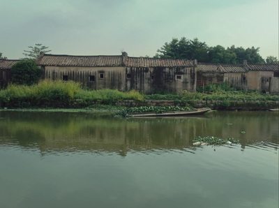 an old building sitting next to a body of water