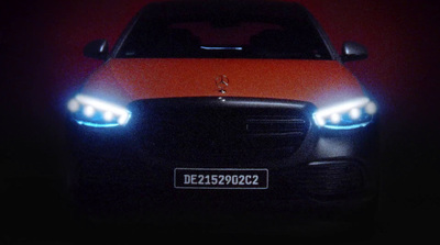 the front of a car with its lights on