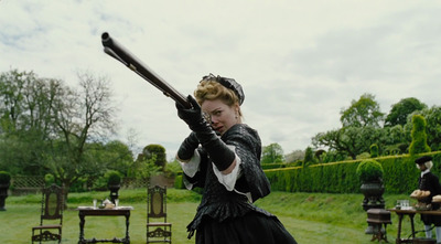 a woman dressed in period clothing holding a gun