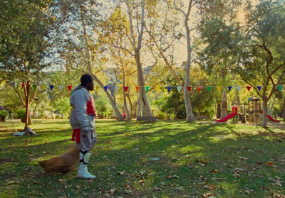 a person standing in a field with a frisbee