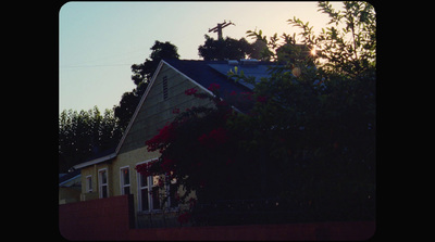 a house with a clock on the top of it