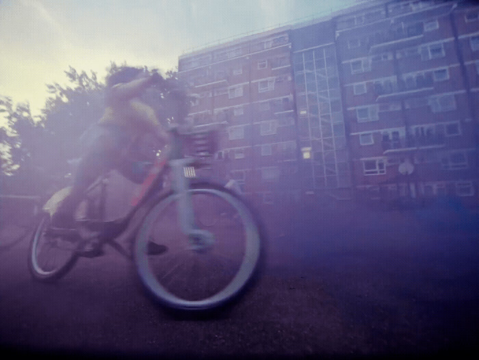 a blurry photo of a person riding a bike