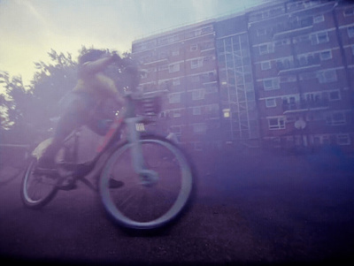 a blurry photo of a person riding a bike