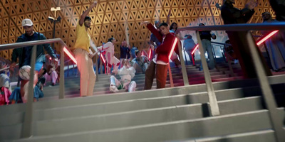 a group of people standing on top of a set of stairs