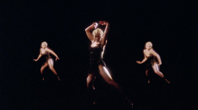 a group of women standing on top of a stage