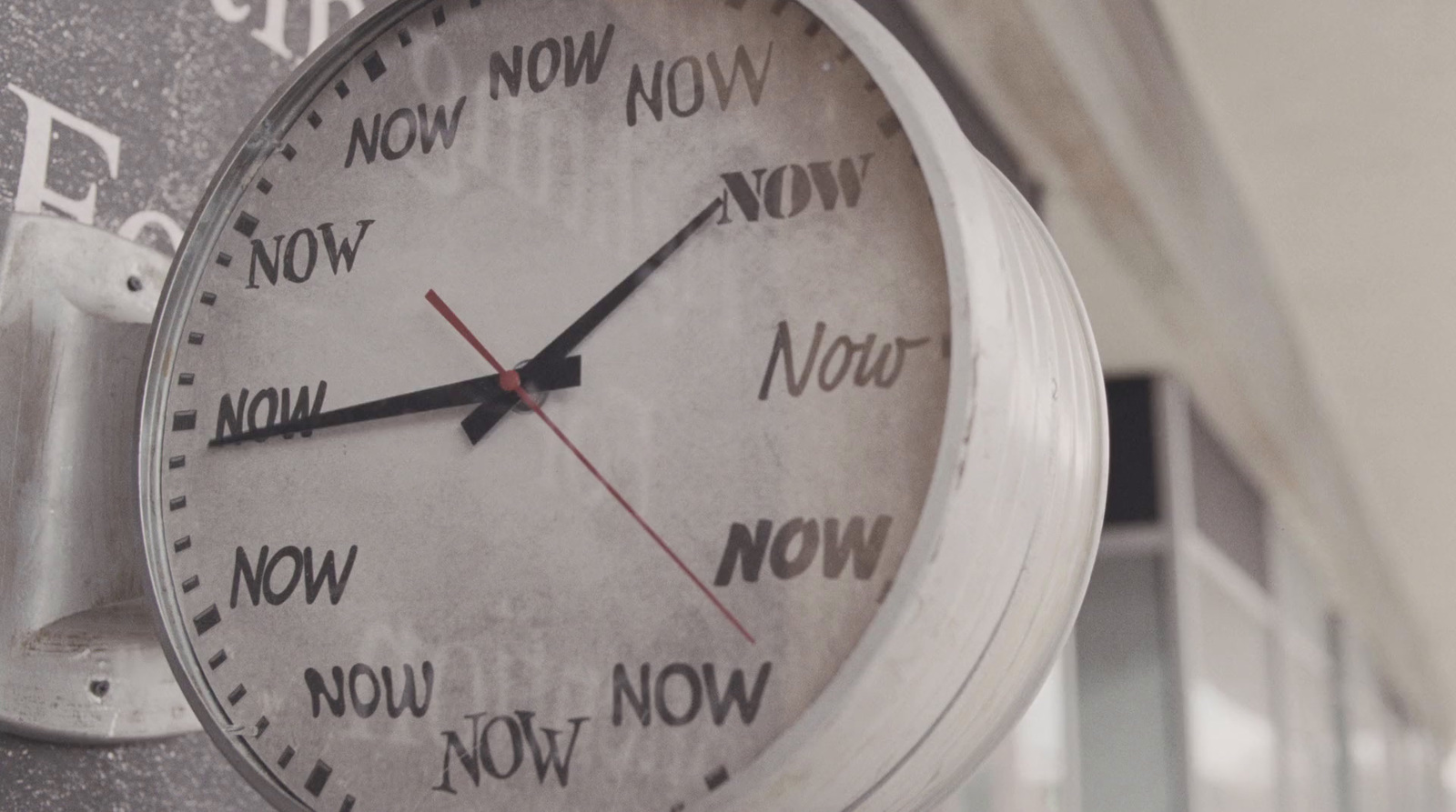 a close up of a clock on a wall