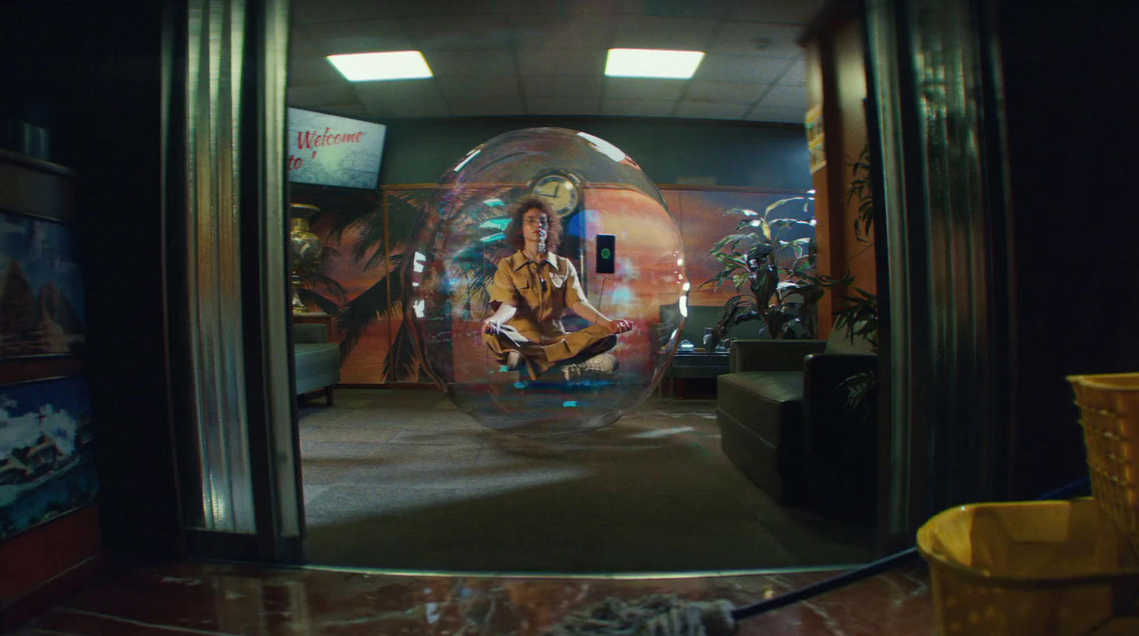 a person sitting inside of a bubble in a room