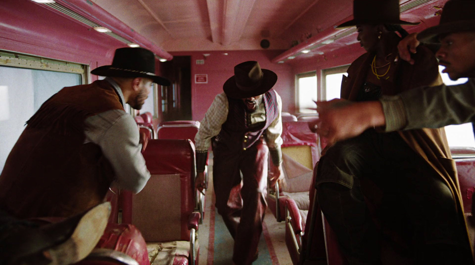 a group of men riding on the back of a bus