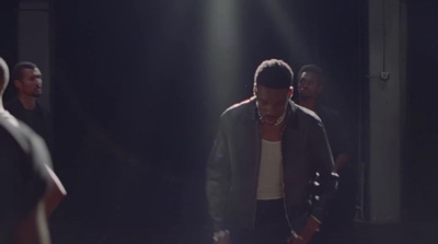 a group of people standing in a dark room