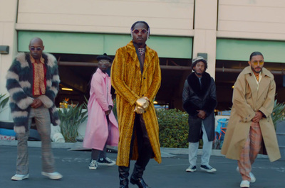 a group of people standing in a parking lot