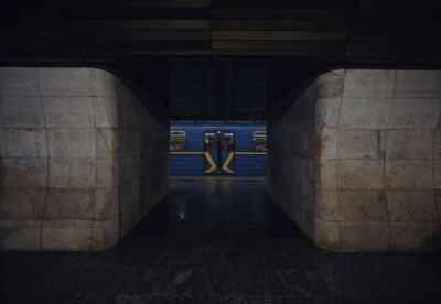 a subway train is coming out of a tunnel