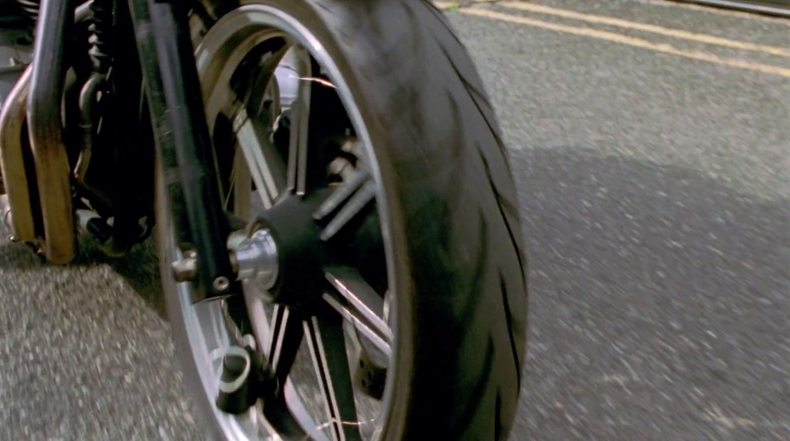 a close up of a motorcycle tire on a street