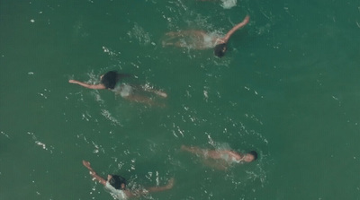 a group of people swimming in a body of water