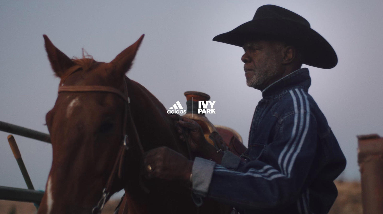 a man in a cowboy hat sitting on a horse