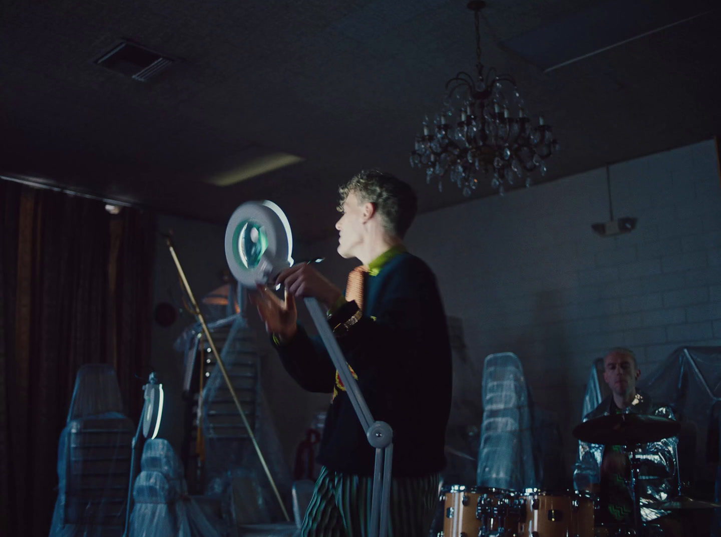 a man in a suit playing a musical instrument