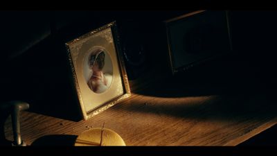 a picture of a baby in a picture frame on a desk