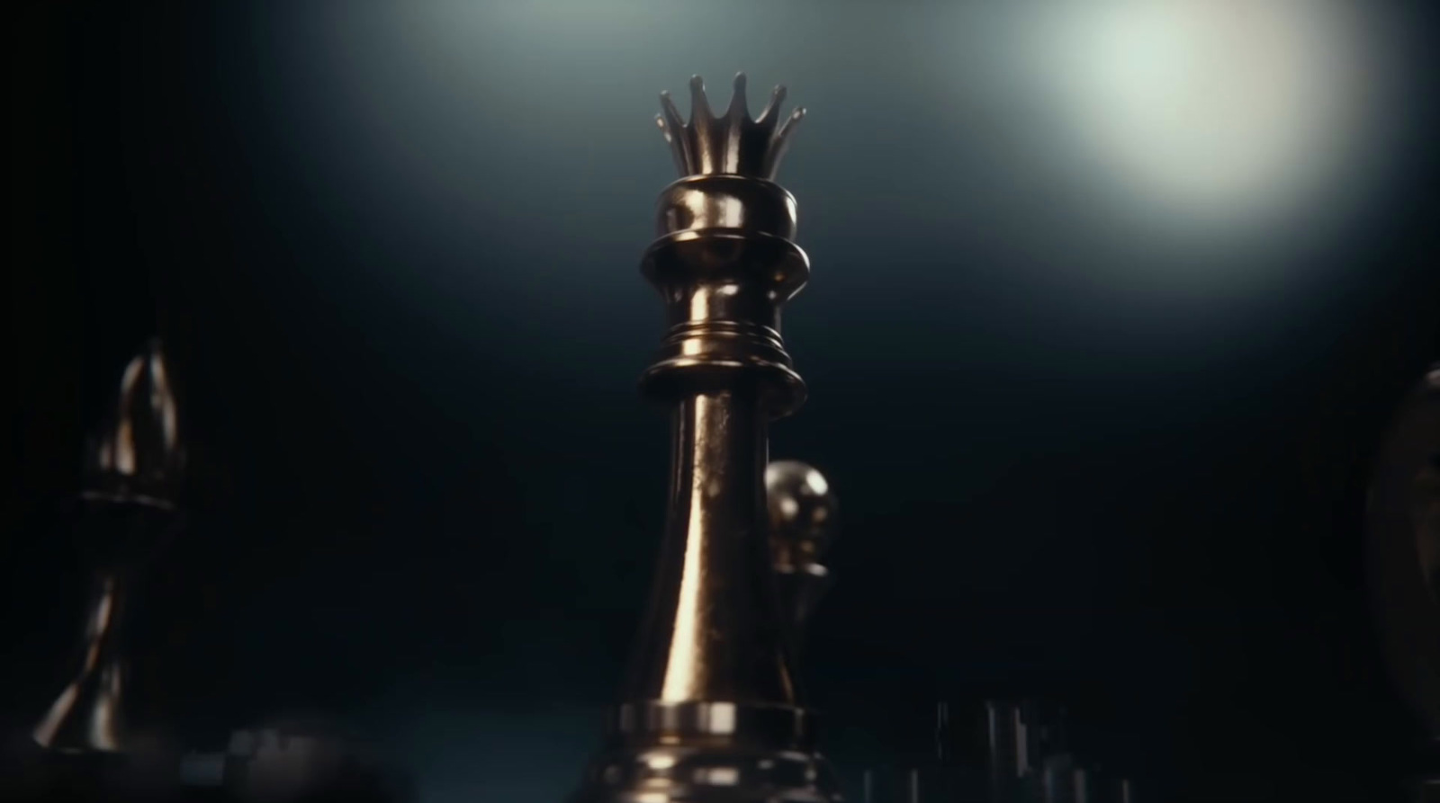 a golden chess piece with a crown on top of it