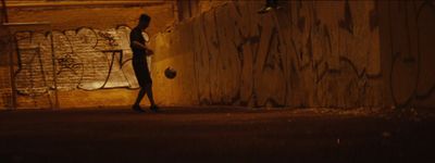 a person walking down a street at night