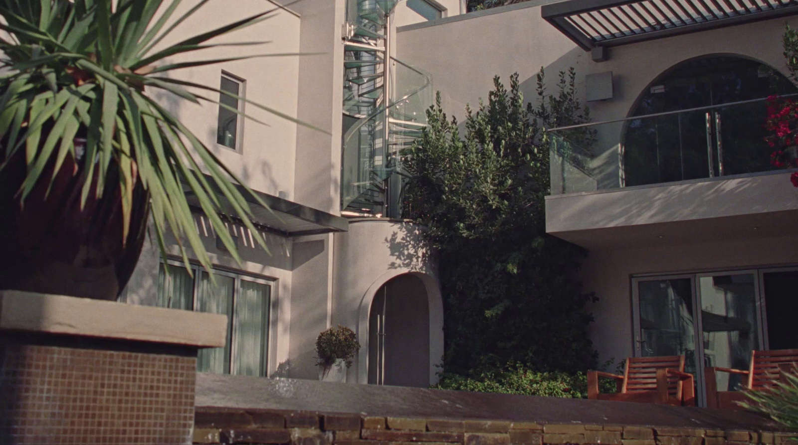 a house with a palm tree in front of it