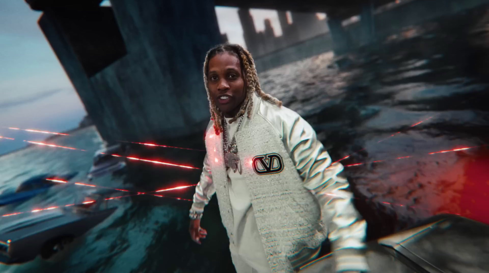 a man with dreadlocks standing in front of a boat